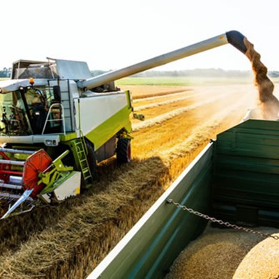 Combine harvester getting crops from a field