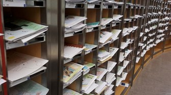 Row of inboxes in EU parliament with petition inside