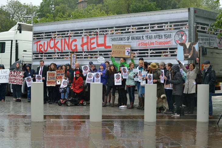 protestors in front of truck branded Trucking Hell
