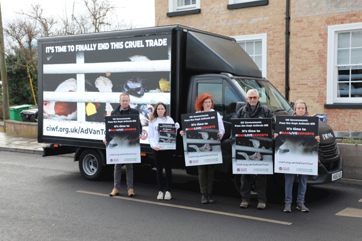 Protesters hold placards by Ban Live Exports Ad Van